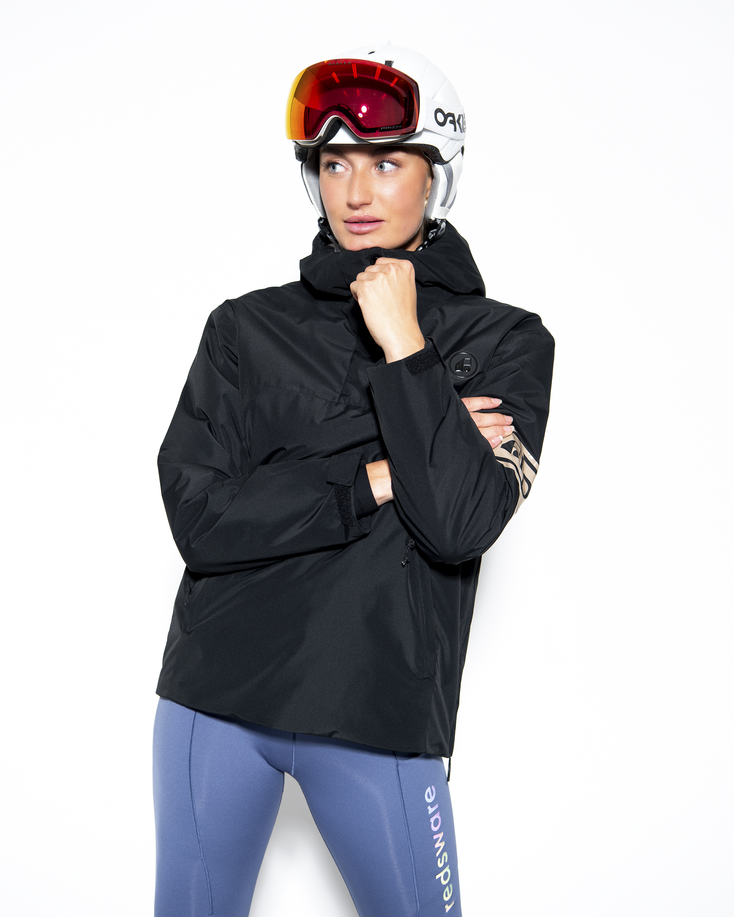 Lou black anorak, three-quarter view styled with helmet