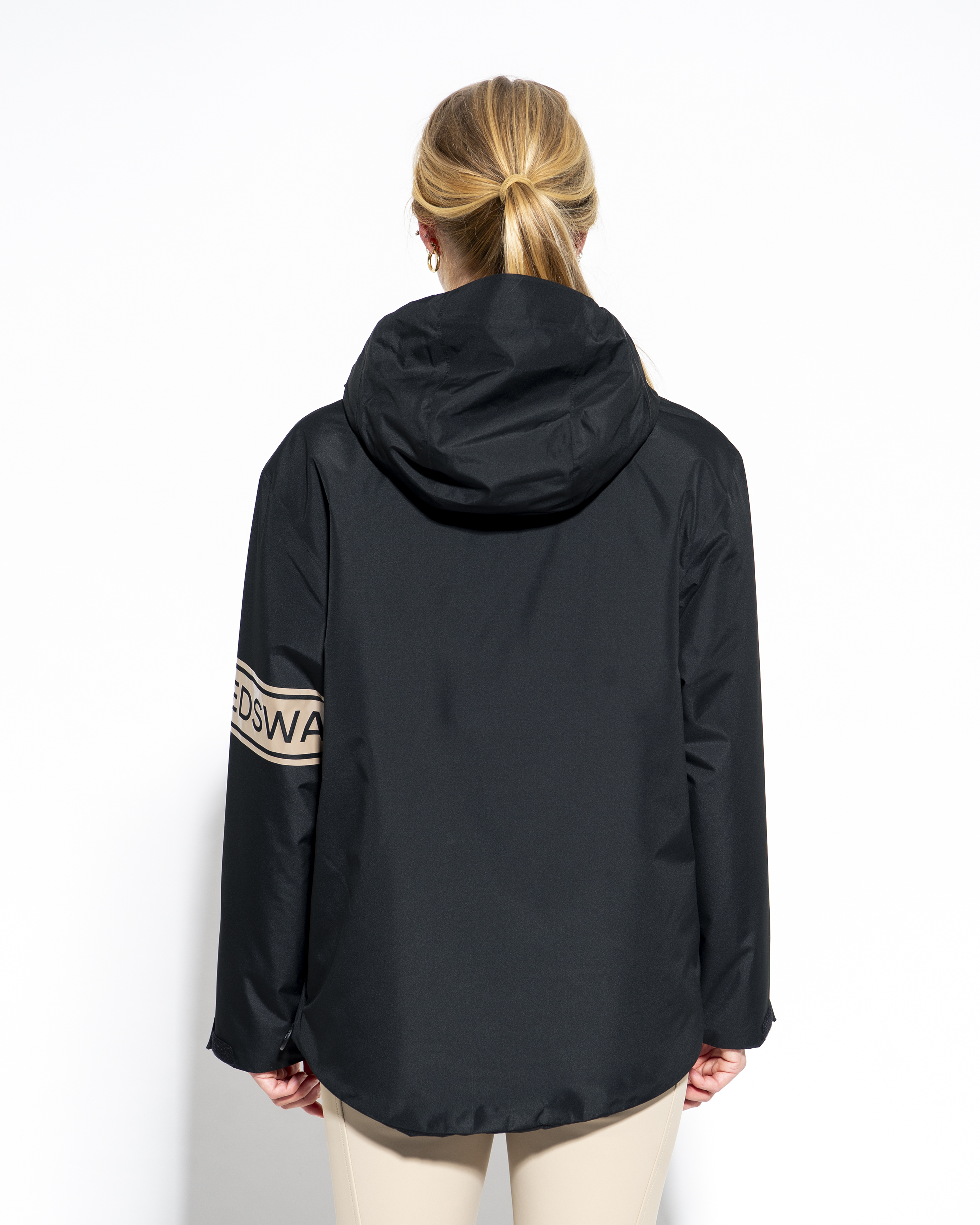 Lou black anorak, rear view showing hood and hem